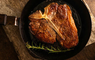 Cooked T Bone steak in skillet