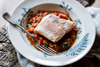 Hake Cooked in Aqua Pazza with white wine, olive oil, chilli, rosemary, and basil. 