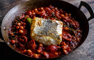 Coley fillet cooked on a bed of chorizo and chickpea stew 