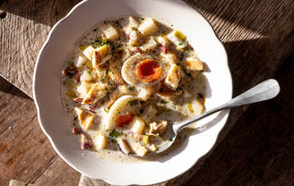 A bowl of smoked haddock chowder with boiled eggs