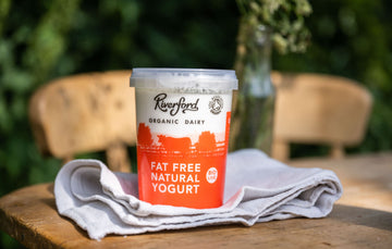 riverford dairy natural fat free yogurt in a pot on a table