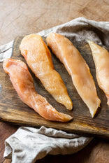 Free-range chicken fillets on a wooden board, Perfect for Mid Week Meals.