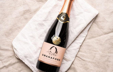 A bottle of Swanaford Brut Rosé sparkling pink wine.