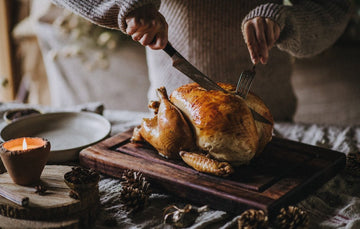 Carving a A cooked whole properly free range bronze turkey